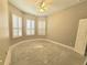 Bedroom with shuttered windows and neutral colored walls at 2515 Se 19Th Cir, Ocala, FL 34471