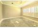 Bright bedroom with shutters on the windows and awaiting new flooring for personalization at 2515 Se 19Th Cir, Ocala, FL 34471