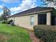 Home's exterior showcasing landscaping and a glimpse of the screened patio and home color at 2515 Se 19Th Cir, Ocala, FL 34471