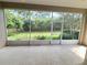 Screened lanai showcasing the backyard at 2515 Se 19Th Cir, Ocala, FL 34471