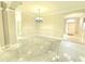 Inviting living area showcasing open layout, elegant lighting, and easy access to other rooms at 2515 Se 19Th Cir, Ocala, FL 34471