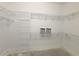 Spacious walk-in closet with wire shelving for optimal storage and organization possibilities at 2515 Se 19Th Cir, Ocala, FL 34471