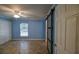 Bedroom showcasing natural light, storage with closet and a sliding door at 3065 Se 142Nd Ln, Summerfield, FL 34491