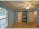 Bedroom leading to bathroom with a sliding door and a view to another room at 3065 Se 142Nd Ln, Summerfield, FL 34491