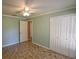 Bedroom featuring tile flooring, closet, and access to hallway at 3065 Se 142Nd Ln, Summerfield, FL 34491