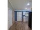 Charming kitchen features neutral tile floors and is painted in cool blue and white tones at 3065 Se 142Nd Ln, Summerfield, FL 34491