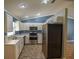 Bright kitchen showcases white cabinets, stainless steel appliances, and marble countertops at 3065 Se 142Nd Ln, Summerfield, FL 34491
