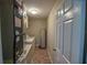 Functional laundry room with utility appliances and built-in shelving for storage at 3065 Se 142Nd Ln, Summerfield, FL 34491