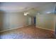 Open-concept living area featuring tile flooring, neutral walls, ceiling fan, and ample space for flexible furniture arrangement at 3065 Se 142Nd Ln, Summerfield, FL 34491