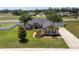 Aerial view showcasing the property with a well-manicured lawn, tasteful landscaping and dark roof at 3612 Se 47Th Ter, Ocala, FL 34480