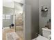 Bathroom featuring a glass shower, a toilet, and decorative shelving, offering a clean aesthetic at 3612 Se 47Th Ter, Ocala, FL 34480