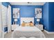 Well-lit bedroom with stylish decor, a cozy bed, and elegant nightstands and window treatments at 3612 Se 47Th Ter, Ocala, FL 34480