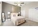 Bright bedroom featuring a ceiling fan, carpet, and an inviting neutral color palette at 3612 Se 47Th Ter, Ocala, FL 34480