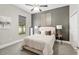 A comfortably decorated bedroom featuring a plush bed with a dark grey accent wall at 3612 Se 47Th Ter, Ocala, FL 34480