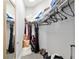 Well-organized closet with ample hanging space and storage, including shelving and floor space at 3612 Se 47Th Ter, Ocala, FL 34480