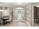 Elegant foyer featuring a decorative front door, tile flooring, and chandelier at 3612 Se 47Th Ter, Ocala, FL 34480