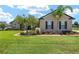 Charming home with well-manicured lawn, landscaping, mature trees and a welcoming front entrance at 3612 Se 47Th Ter, Ocala, FL 34480