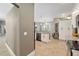 Bright kitchen featuring tile floors, stainless steel appliances, white cabinets, and an island with bar seating at 3612 Se 47Th Ter, Ocala, FL 34480