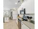 Well-equipped kitchen with stainless steel appliances, ample counter space, and stylish white cabinetry at 3612 Se 47Th Ter, Ocala, FL 34480