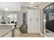 Kitchen with a wine fridge, white cabinets, and an island in the center at 3612 Se 47Th Ter, Ocala, FL 34480