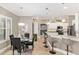 Bright open kitchen with breakfast bar, stainless appliances, and adjacent dining area at 3612 Se 47Th Ter, Ocala, FL 34480