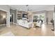 Bright and airy living room with a fireplace, built-in shelves, and access to the pool area at 3612 Se 47Th Ter, Ocala, FL 34480