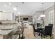 Open-concept living space featuring a modern kitchen, dining area, and comfortable seating area at 3612 Se 47Th Ter, Ocala, FL 34480