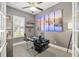 A modern office space featuring a unique desk, neutral walls, and lots of light at 3612 Se 47Th Ter, Ocala, FL 34480