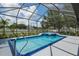 Spectacular screened pool and spa offers privacy and relaxation with lush landscaping and a covered patio area at 3612 Se 47Th Ter, Ocala, FL 34480