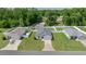 Overhead view of single-Gathering homes with fenced yards and manicured lawns at 4909 Se 89Th St, Ocala, FL 34480