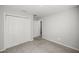 Bedroom with a closet and neutral carpet, offering a serene space for rest and relaxation at 4909 Se 89Th St, Ocala, FL 34480