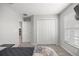 Bedroom with a large closet, window, and soft carpet providing a comfortable living space at 4909 Se 89Th St, Ocala, FL 34480