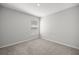 Neutral bedroom with a window bringing in natural light and neutral carpet providing a blank canvas at 4909 Se 89Th St, Ocala, FL 34480