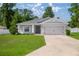 Charming single-story home with a well-manicured lawn and a two-car garage, perfect for suburban living at 4909 Se 89Th St, Ocala, FL 34480