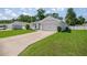 Charming single-story home with a well-manicured lawn and paved driveway at 4909 Se 89Th St, Ocala, FL 34480