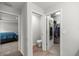 Hallway view featuring a bedroom, water closet, and walk-in closet at 4909 Se 89Th St, Ocala, FL 34480
