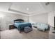 Spacious main bedroom features a tray ceiling, a plush bed, and a relaxing sitting area at 4909 Se 89Th St, Ocala, FL 34480