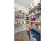 Walk-in pantry offers ample shelving for food storage with tile flooring and great organization at 4909 Se 89Th St, Ocala, FL 34480