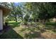 Lush backyard featuring a circular landscaped garden, offering a beautiful and tranquil outdoor space at 4992 Nw 31St St, Ocala, FL 34482