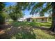 Picturesque backyard with mature trees and landscaping, providing ample shade and a peaceful setting at 4992 Nw 31St St, Ocala, FL 34482