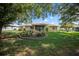 Expansive backyard featuring lush lawn and a well-maintained landscaped garden, perfect for outdoor activities at 4992 Nw 31St St, Ocala, FL 34482