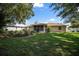 Spacious backyard with a charming landscaped garden, offering a serene and private outdoor experience at 4992 Nw 31St St, Ocala, FL 34482