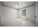 Well-lit bedroom with a window offering a pleasant outdoor view at 4992 Nw 31St St, Ocala, FL 34482