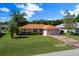 Charming single story home with a well manicured lawn and an attached two car garage at 4992 Nw 31St St, Ocala, FL 34482