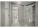 Hallway featuring tile floors and access to the bathroom, bedrooms and living spaces at 4992 Nw 31St St, Ocala, FL 34482