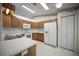 Functional kitchen with white appliances and ample cabinet space at 4992 Nw 31St St, Ocala, FL 34482