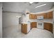 Well-lit kitchen featuring tiled floors and modern appliances at 4992 Nw 31St St, Ocala, FL 34482