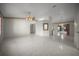 Spacious living room featuring tile floors, ceiling fans and access to other rooms at 4992 Nw 31St St, Ocala, FL 34482