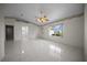 Spacious living room featuring tile floors, ceiling fan, and a window view at 4992 Nw 31St St, Ocala, FL 34482