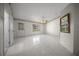 Spacious living room featuring tile floors, ceiling fan, and a window view at 4992 Nw 31St St, Ocala, FL 34482